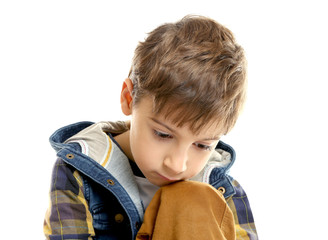 Portrait of little thoughtful boy isolated on white