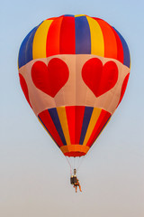 Pilot hot air balloon on poor sky