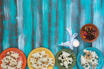 Colored dishes with cookies for Christmas