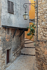 Fototapeta na wymiar Narrow cobbled street in the old village France.