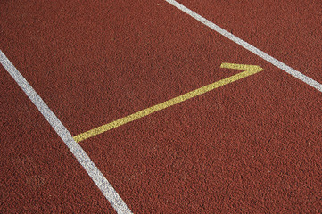 Athletics stadium running track white lines marks.

