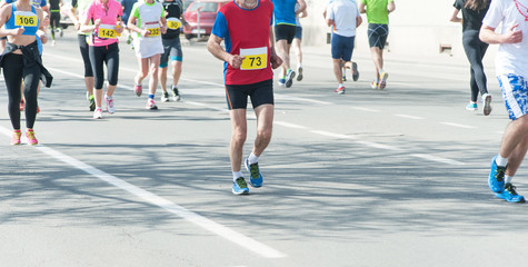 Marathon, street runners  in spring day