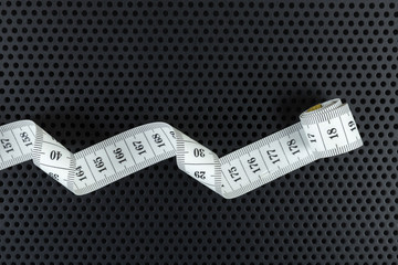 Curved white measuring tape