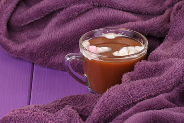 hot chocolate, cozy knitted blanket.