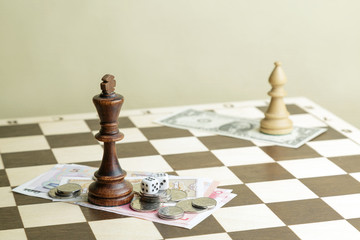 Dice, money and chess the king on a board