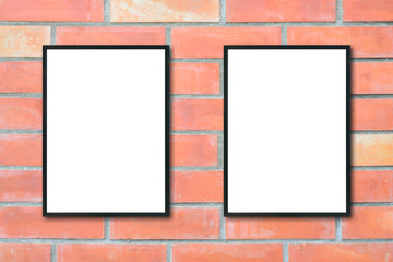 Mock up blank poster picture frame on brick wall.