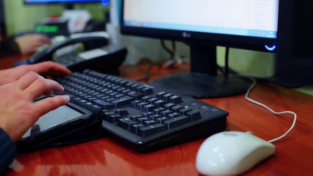Man hands typing on a laptop keyboard
