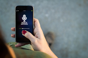 Woman walking smartphone voice message interface
