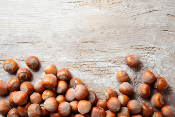 Hazelnut. Fresh organic filbert. Nuts on wooden background.