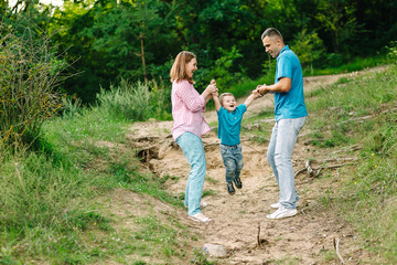 happy family walking in the park playing