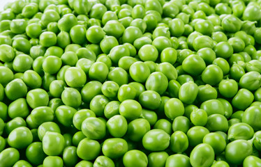 Fresh peas. Green background.