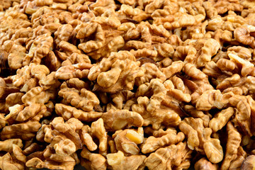 Walnut background. Peeled Nuts. Macro