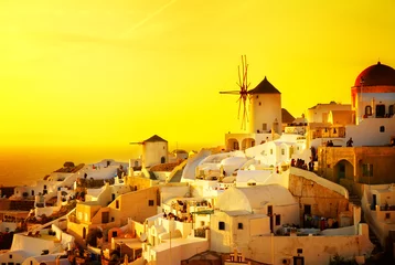 Wall murals Yellow famouse orange sunset of Oia with windmill, Santorini, retro toned