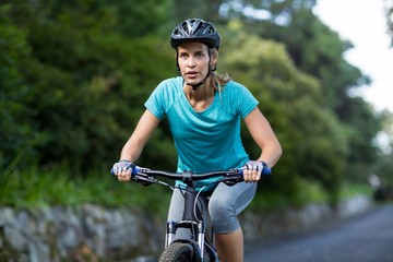 Woman cycling on the road