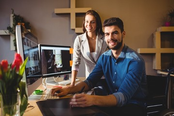 Graphic designers using a graphics tablet