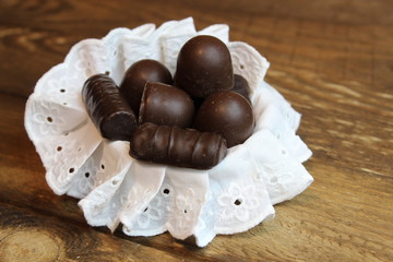 Chocolate candy on a wooden board