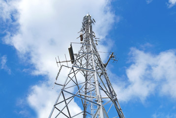 Telecommunication tower with antennas  blue sky