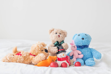 Teddy bear and the gang whit christmas decoration on a white background