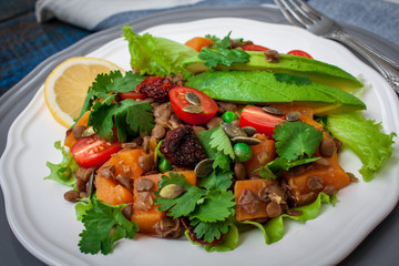 Salad with baked sweet potatoes, avocados, lentils, dried tomatoes, cilantro, pumpkin seeds and oil. .  Perfect for the detox diet or just a healthy meal.  Love for a healthy raw food concept.