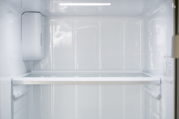 Empty open fridge with shelves, refrigerator.
