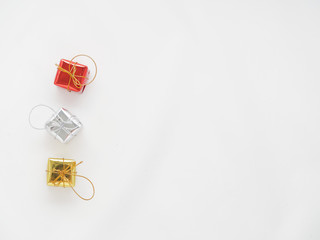 Red, silver, and gold gift boxes on isolated white background
