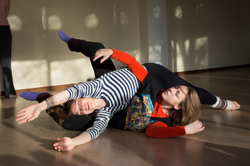 Two women dancing dance contact improvisation