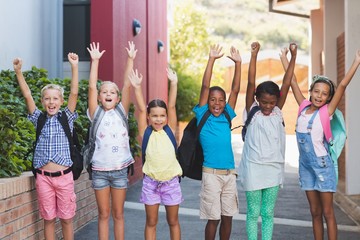 Group of kids standing in a row at school campus