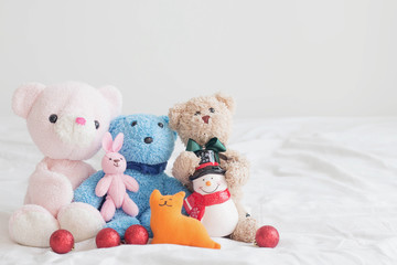 Teddy bear and the gang with christmas decoration on a white background