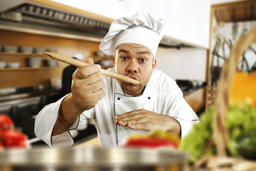 Cook chef in kitchen 