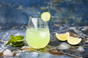 Sparkling cucumber mint gin and tonic fizz with aloe vera on marble table. Copy space