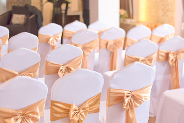 beautiful chairs decoration with ribbon in wedding event hall,se