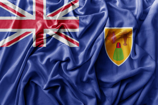 Ruffled waving Turks and Caicos Islands flag - Powered by Adobe