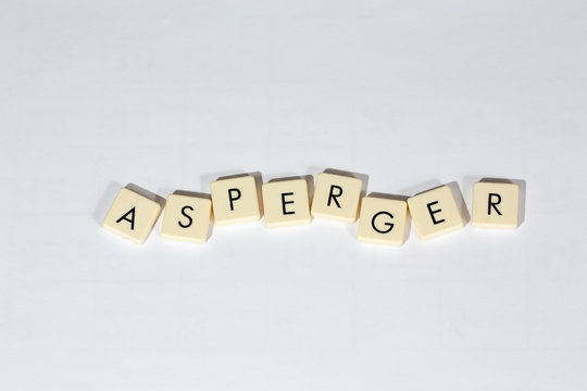Asperger text on a white surface. Asperger Syndrome is a neurobiological disorder on the higher-functioning end of the autism spectrum.