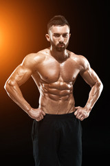 Fototapeta na wymiar Muscular bodybuilder guy doing posing
