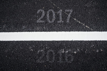 Good bye Old year 2016 and Happy New year 2017 on Asphalt Texture