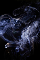 White smoke movement on black background.