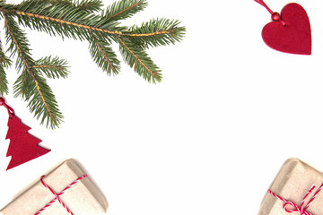 Christmas composition. Green fir twings, Xmas gifts and decorations on white background. Top view, flat lay. Copy space for text