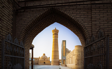 Yard of Poi Kalyan oriental complex at sunset. View from the gate. Bukhara, Uzbekistan