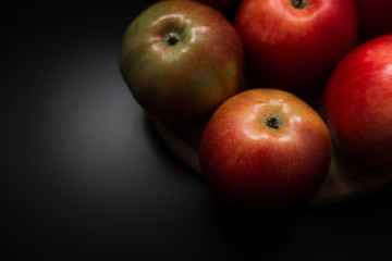 Fresh organic apples on a black background
