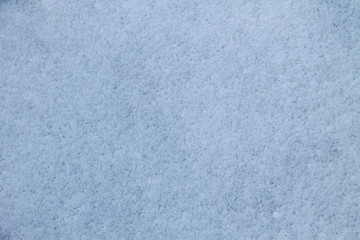 Naklejka premium Texture of the white snow. Winter background 