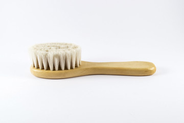 Baby hairbrush on white background