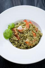 Risotto with spinach, tiger shrimps, tomatoes and fresh basil