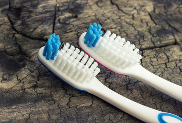 Toothbrush on wooden background. Soft focus.Tinted