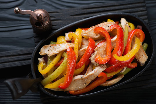 Closeup of fajitas with colorful bell peppers and chicken fillet