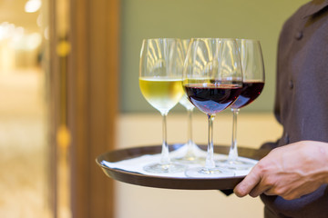 Woman holding a glass of wine.