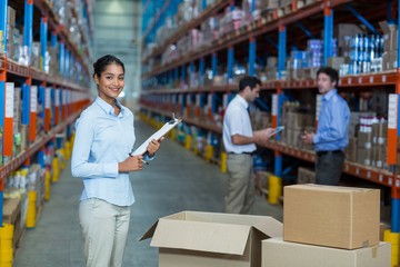 Focus of manager is smiling and posing during work