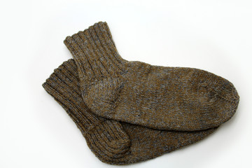 Knitted wool socks on a white background.