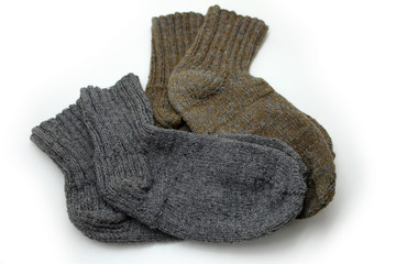 Knitted wool socks on a white background.