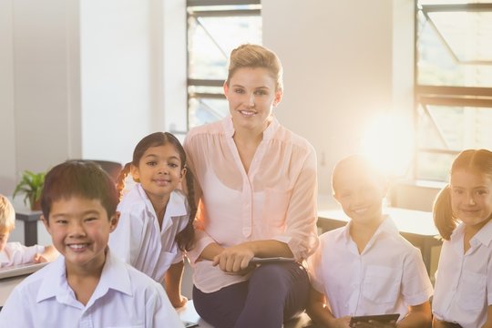 Teacher with students in classroom