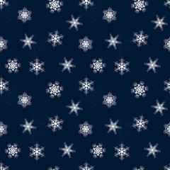seamless winter pattern of Lacy snowflakes on blue background